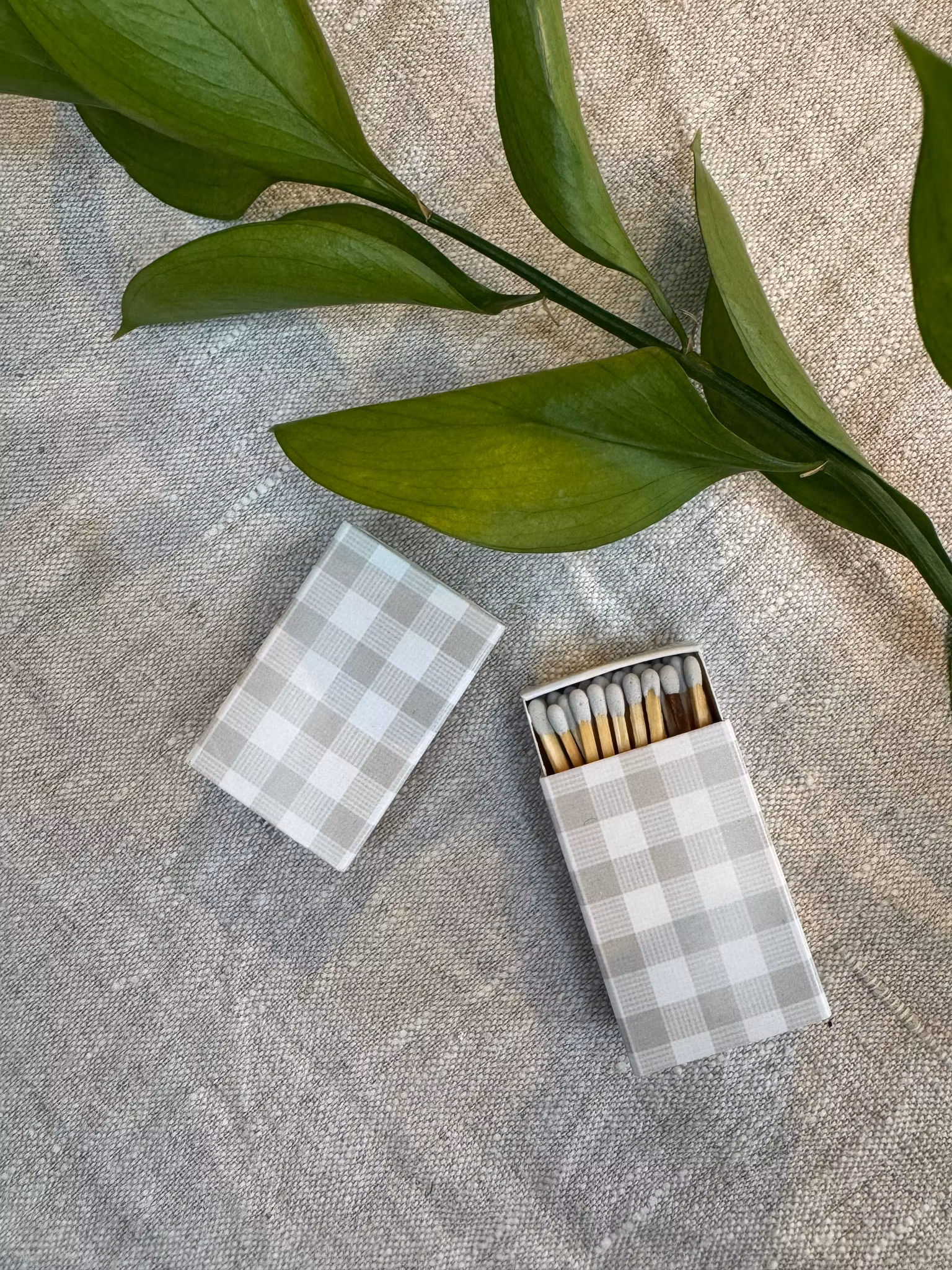 Tändstickor grå rutig liten