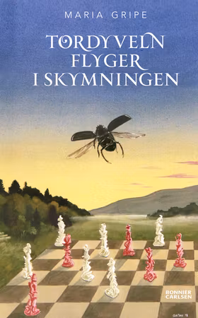 Tordyveln flyger i skymningen