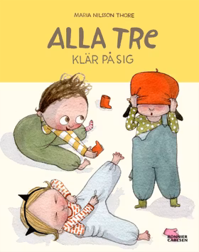 Alla tre klär på sig