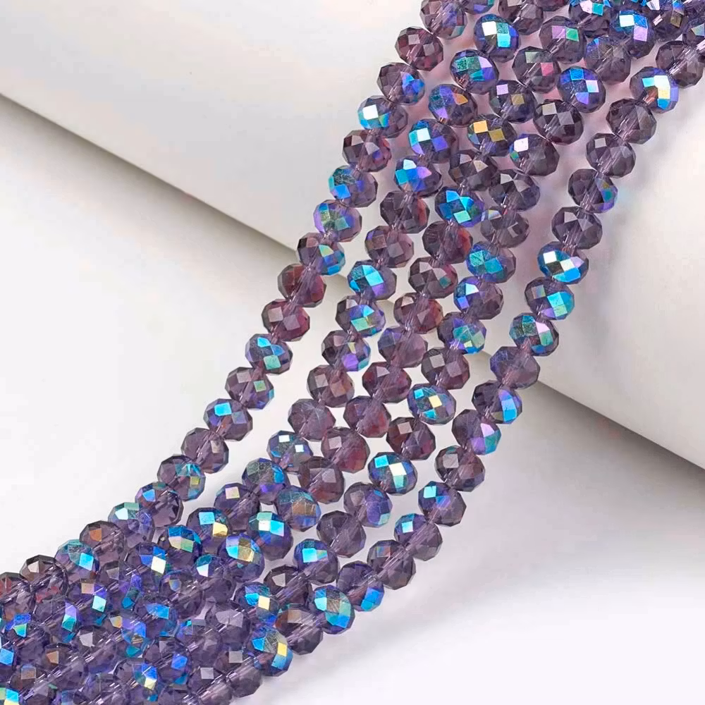 2241 Fasetterad rondell regnbågspläterad indigo glas 6mm på sträng