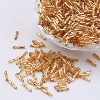 3933 Bugle/rör pärlor i glas twisted metallic golden 12x2mm  200stk