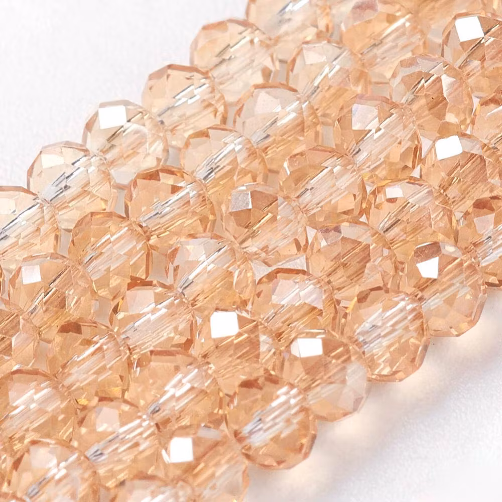 3990 Glaspärla rondell ljusguldgul 3,5x2,5~3mm