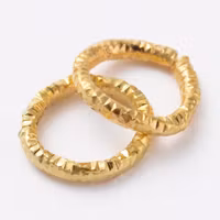 4046 Bindring guld HEL tvinnad 7,5mm 50stk