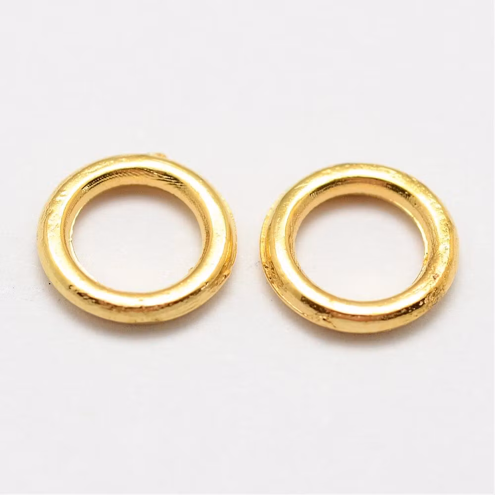 4054 Bindring guld HEL 7x1mm hål 4,5mm 50stk