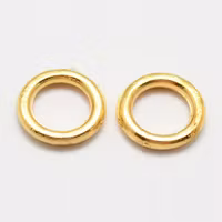 4054 Bindring guld HEL 7x1mm hål 4,5mm 50stk