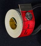 Måttband med knapp