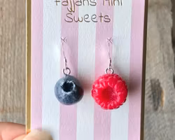 Earrings, a raspberry and a blueberry