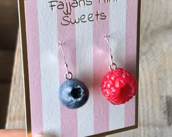 Earrings, a raspberry and a blueberry