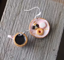 Earrings, pink cookie plate with coffee cup