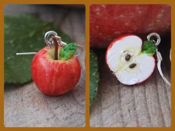 Örhängen, en äpplehalva och ett helt äpple