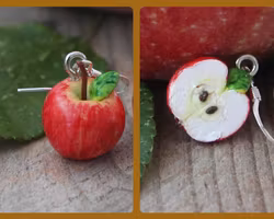 Örhängen, en äpplehalva och ett helt äpple