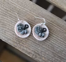 Earrings, blue coffee plates with vacuum cleaner, chocolate ball and cinnamon bun