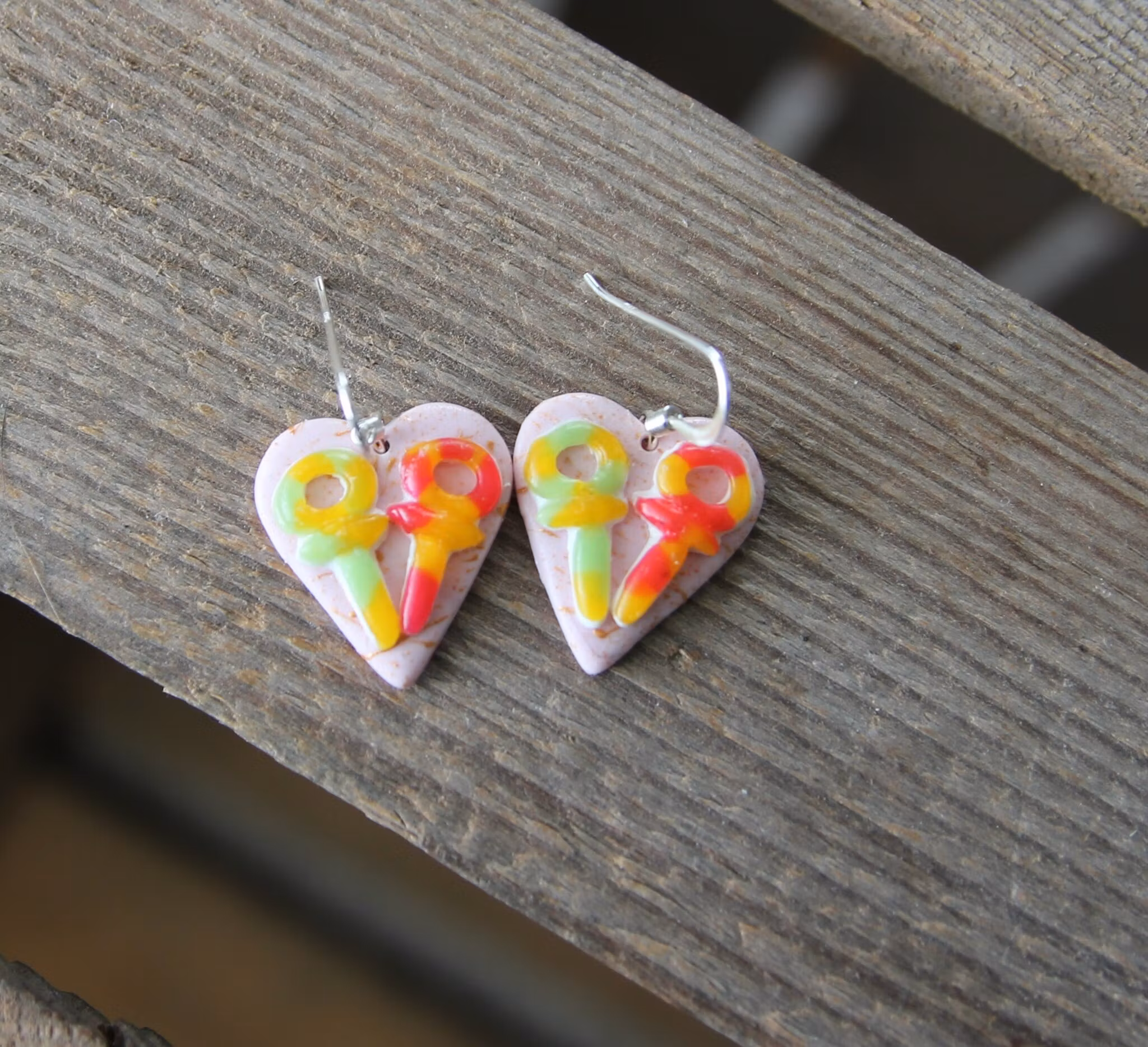 Earrings, blue coffee plates with vacuum cleaner, chocolate ball and cinnamon bun