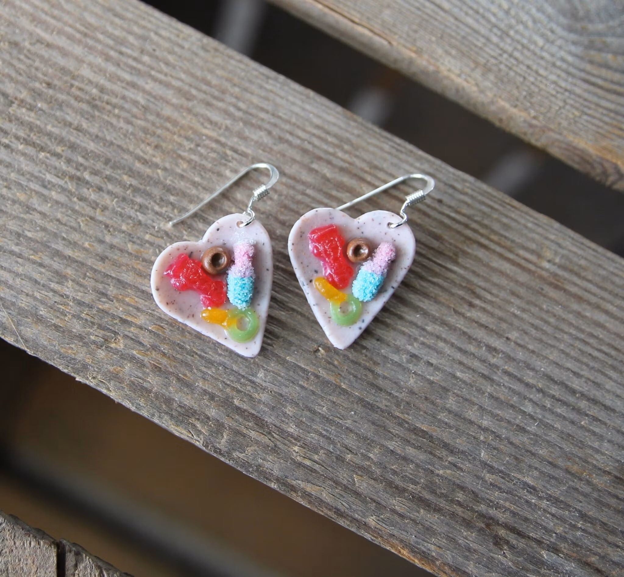 Earrings, blue coffee plates with vacuum cleaner, chocolate ball and cinnamon bun