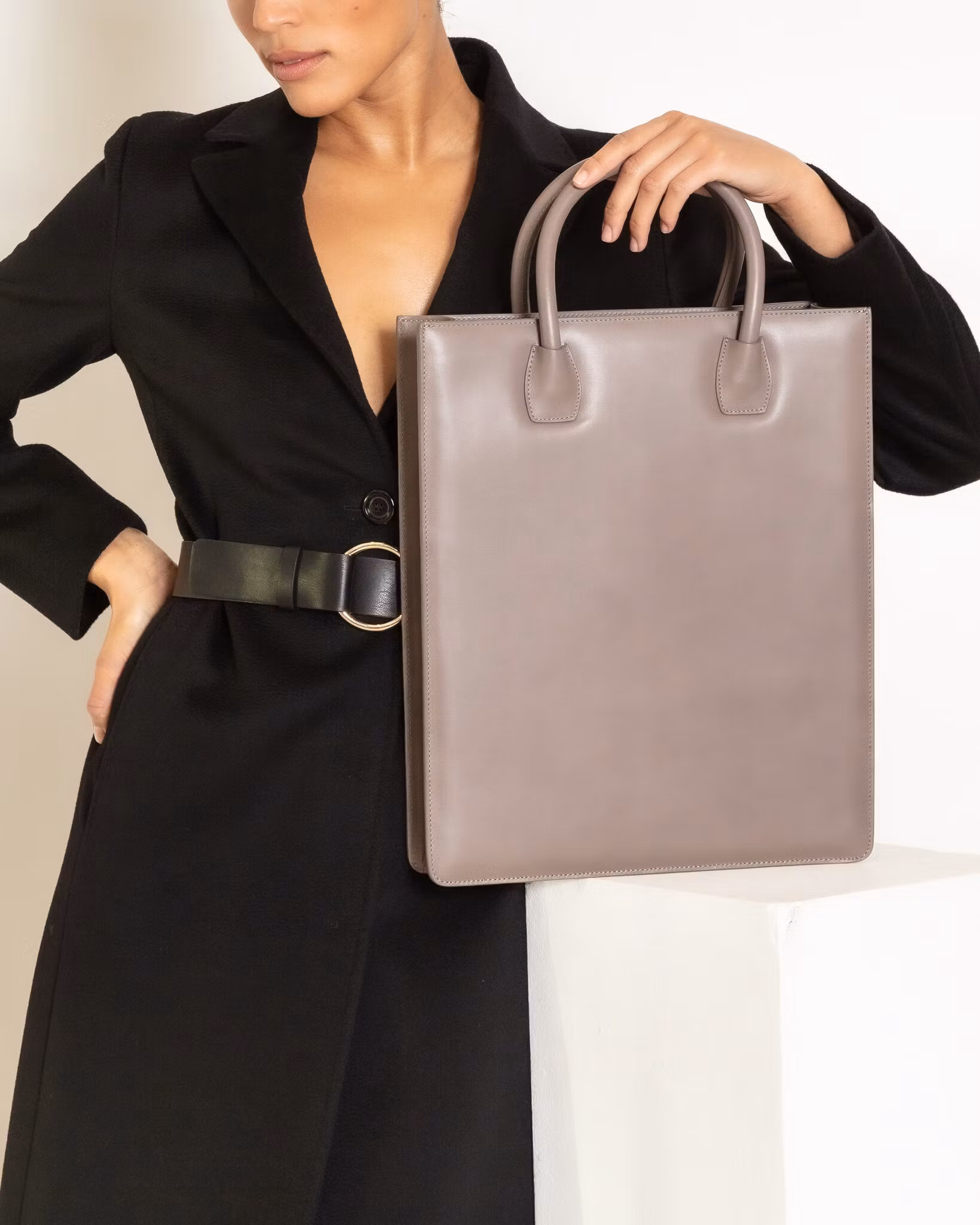 ANTON ALICE Tote Bag No 1 structured leather tote in taupe, worn by a model