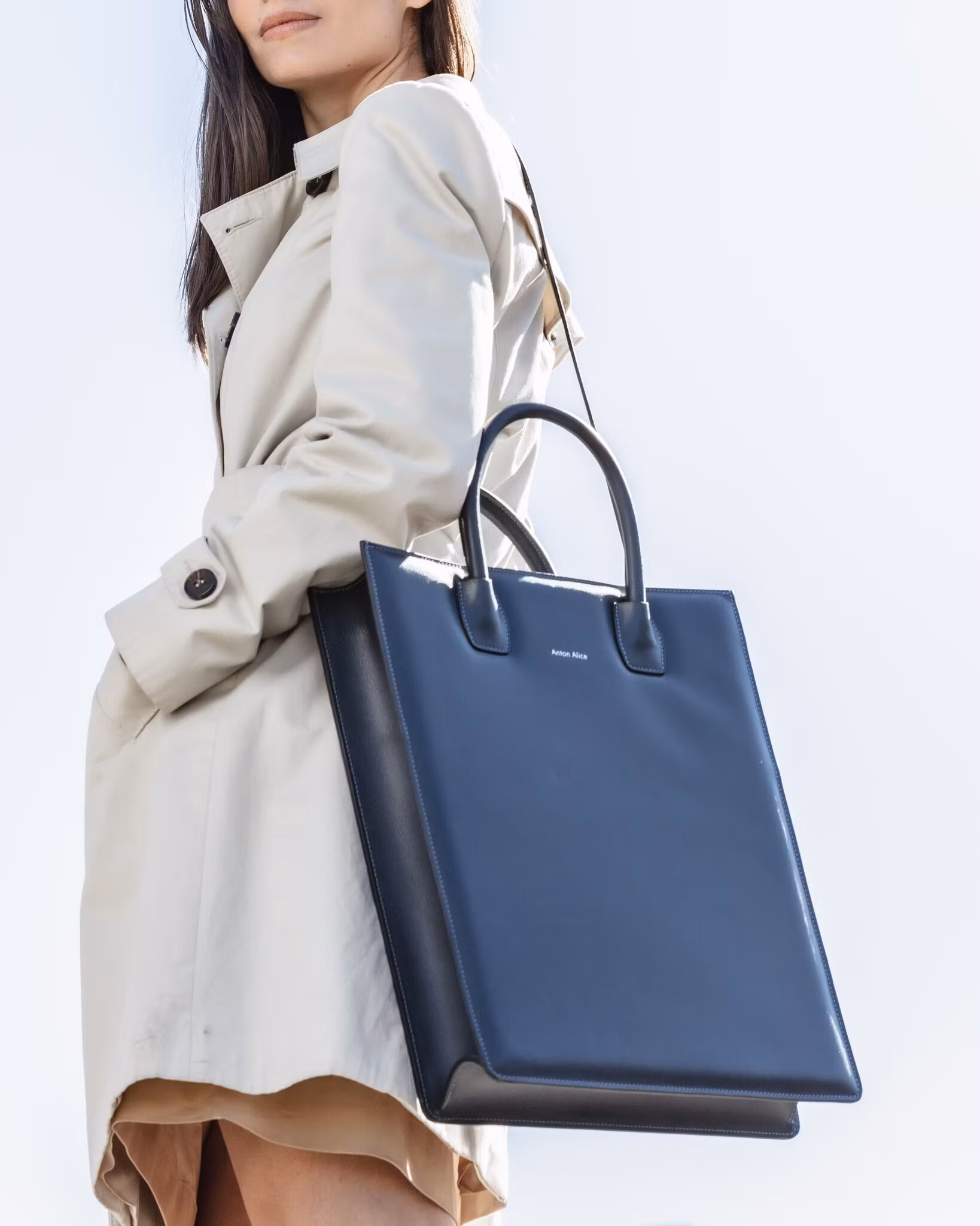 ANTON ALICE Tote Bag No 1 structured leather tote in navy blue, worn by a model