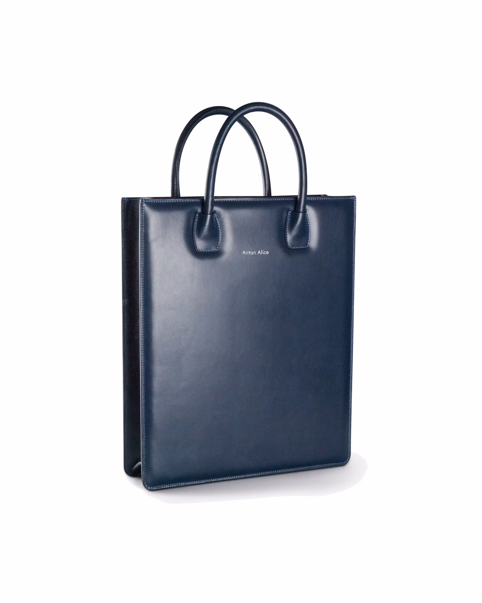 ANTON ALICE Tote Bag No 1 structured leather tote in navy blue, seen at an angle