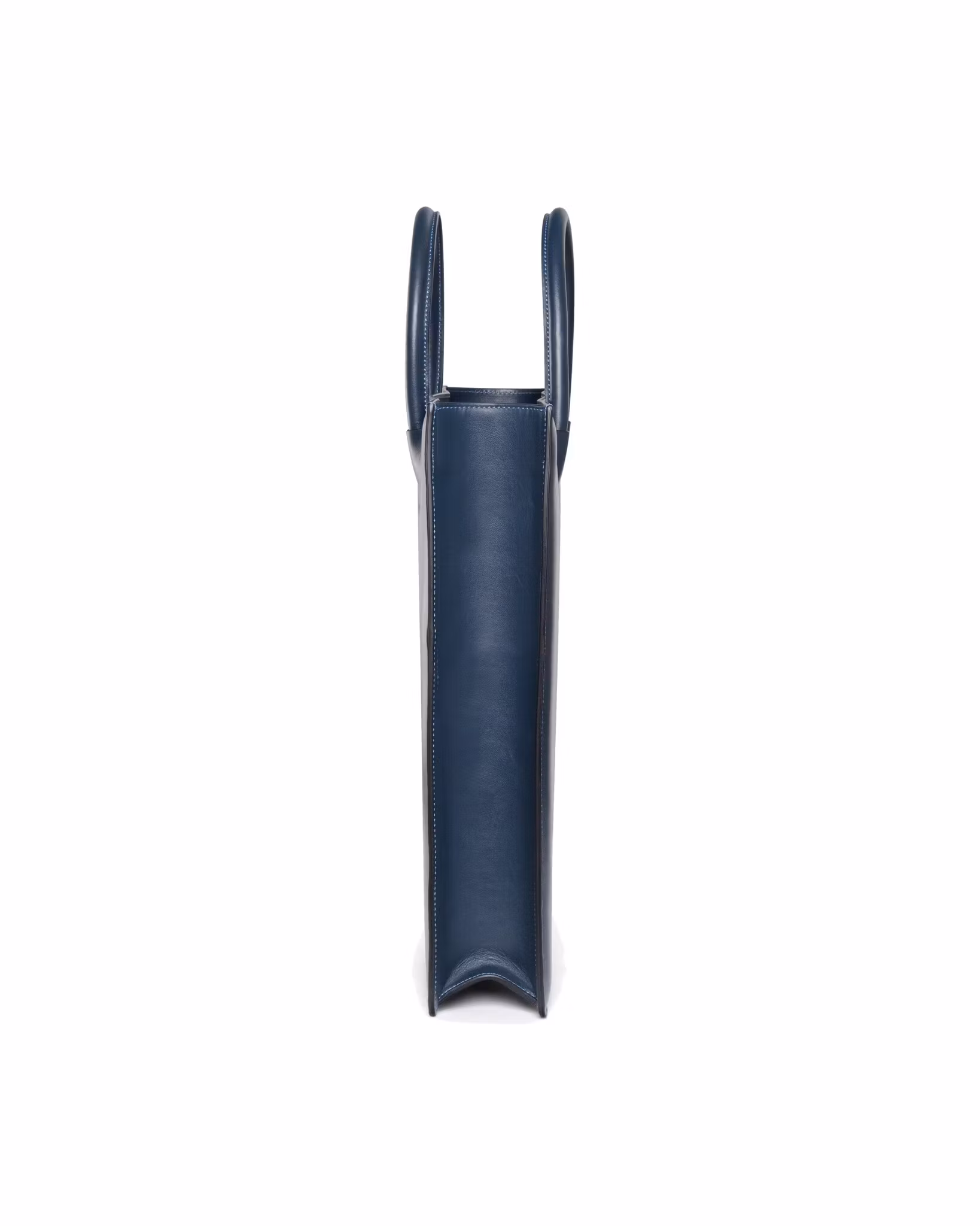 ANTON ALICE Tote Bag No 1 structured leather tote in navy blue, side view showing the slim profile