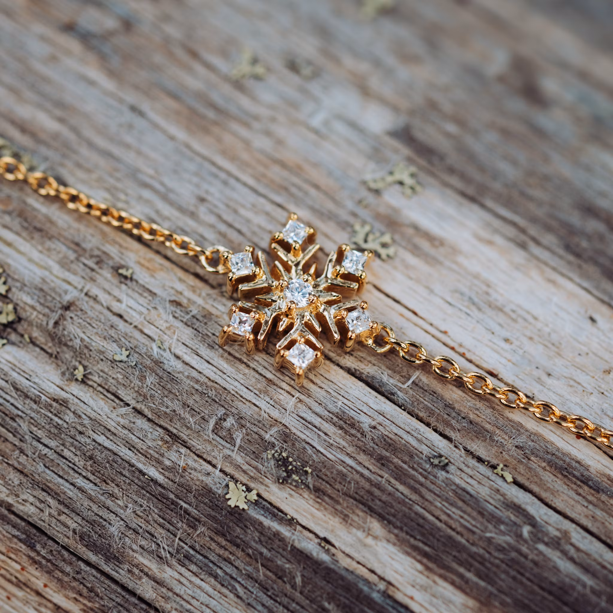 Snöflinga armband guld