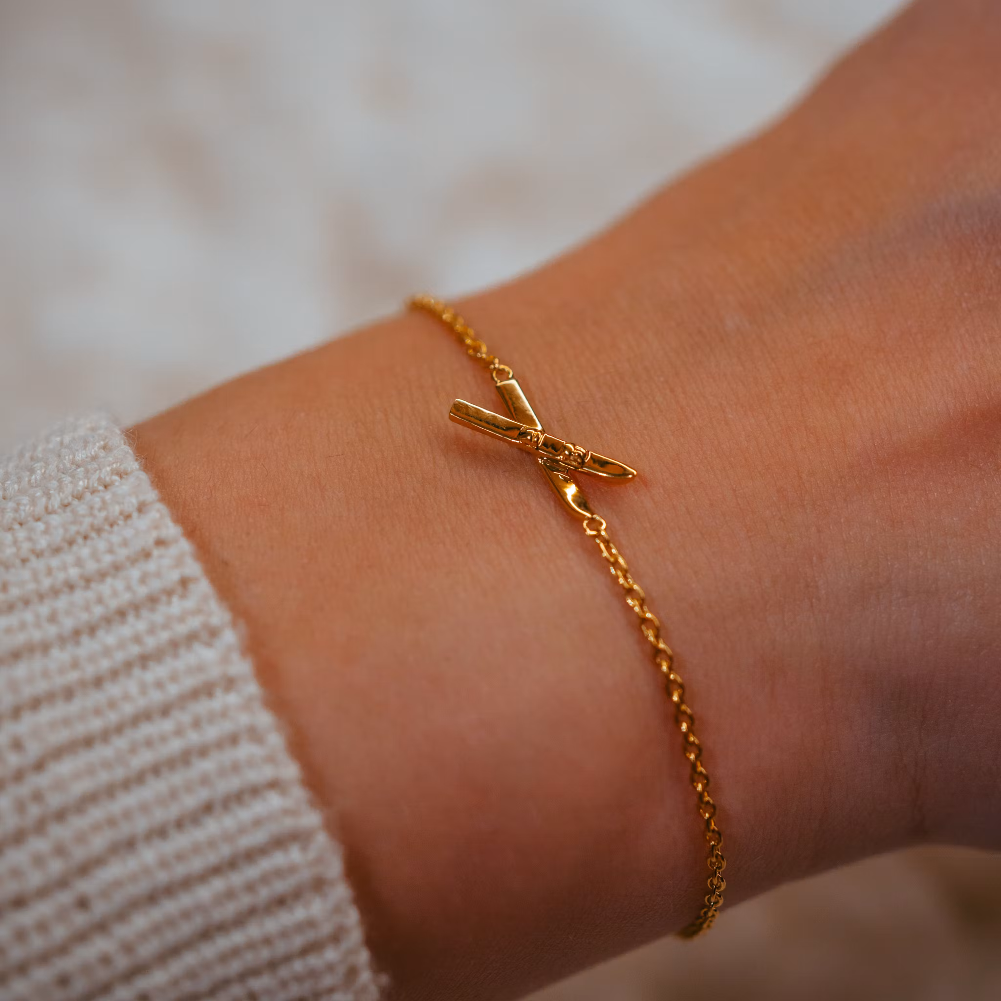 Skida armband guld