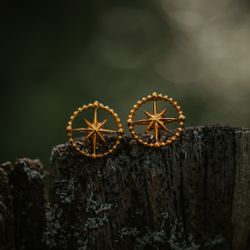 Kompass örhängen guld