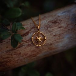 Kompass halsband guld