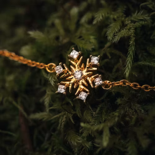 Snöflinga armband guld