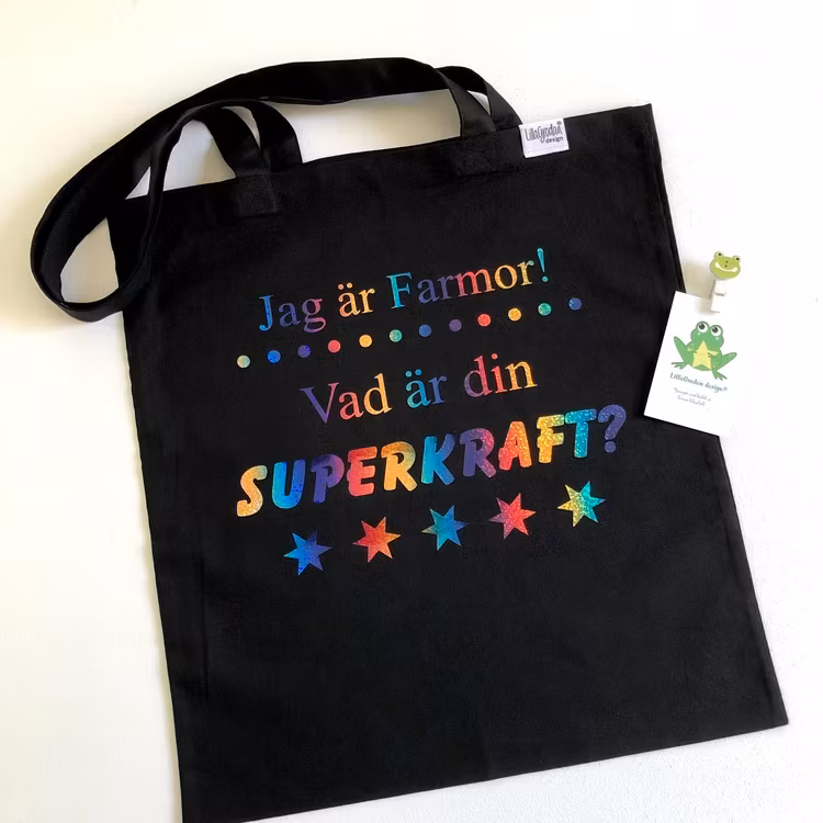 Tygkasse svart: Jag är... Vad är din SUPERKRAFT?, vinyl Regnbåge Skimmer