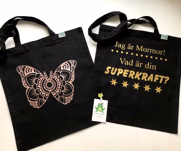 Tygkasse ”Superkraft” med guldvinyl samt Mandala Fjäril, vinyl Guld Rosé