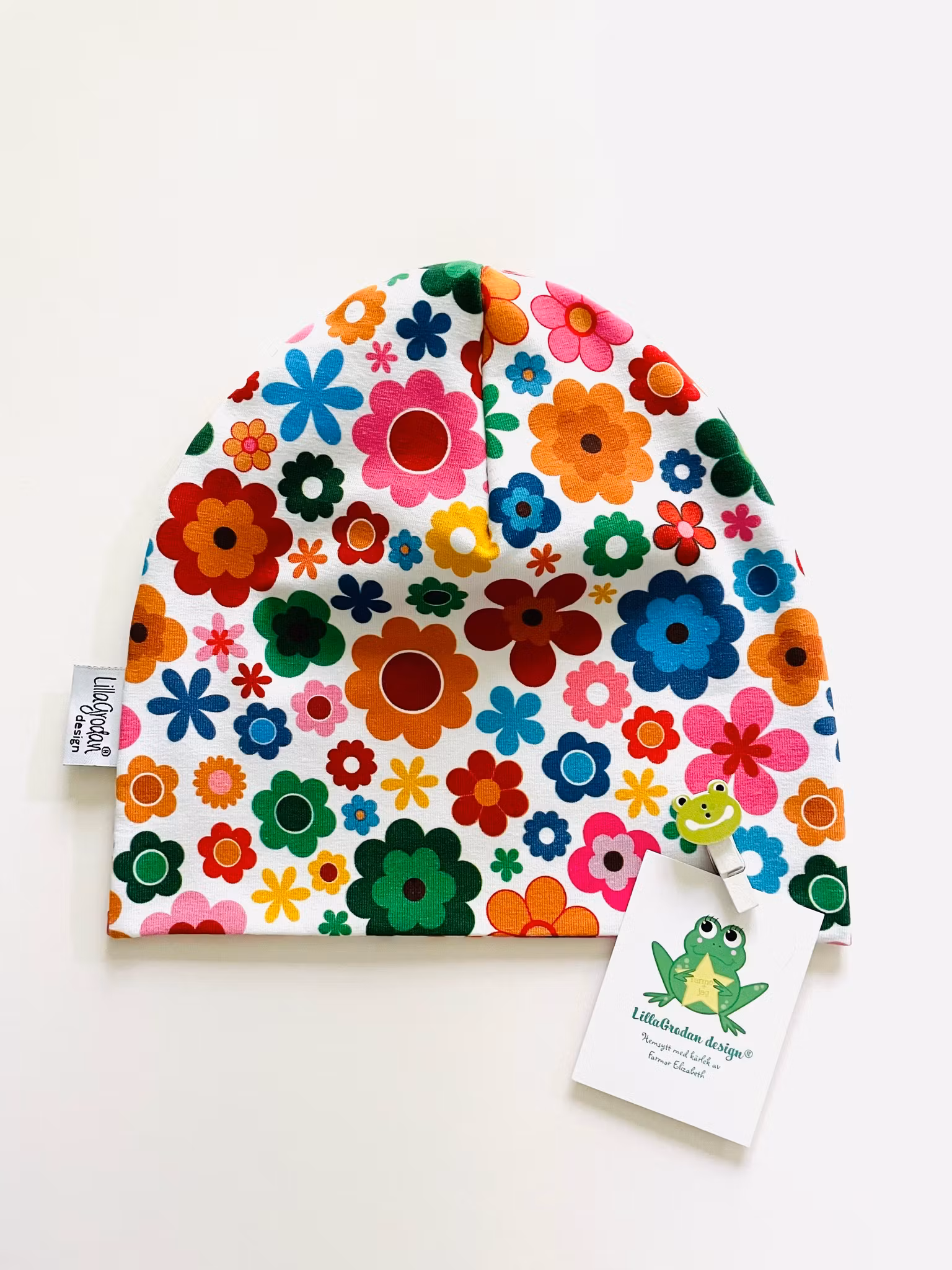 baggymössa Blommor Färgmix strl 46/48 - Uppsytt