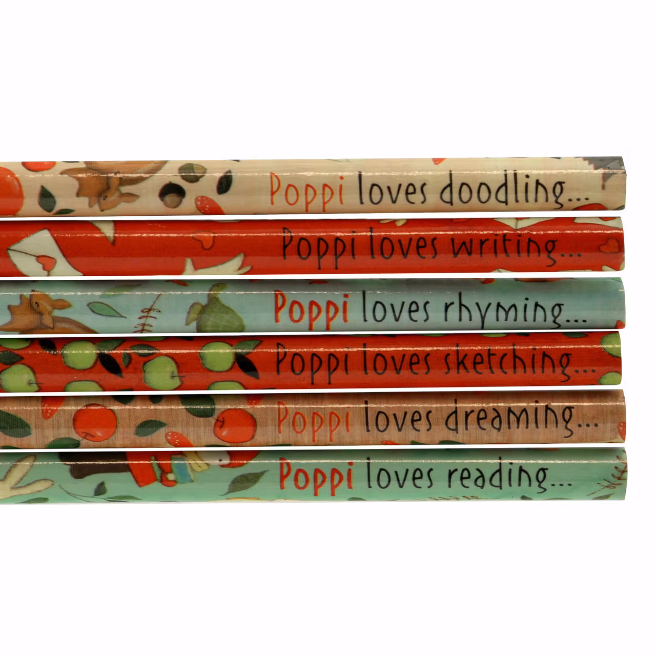 Set med pennor, pennvässare, sudd och block