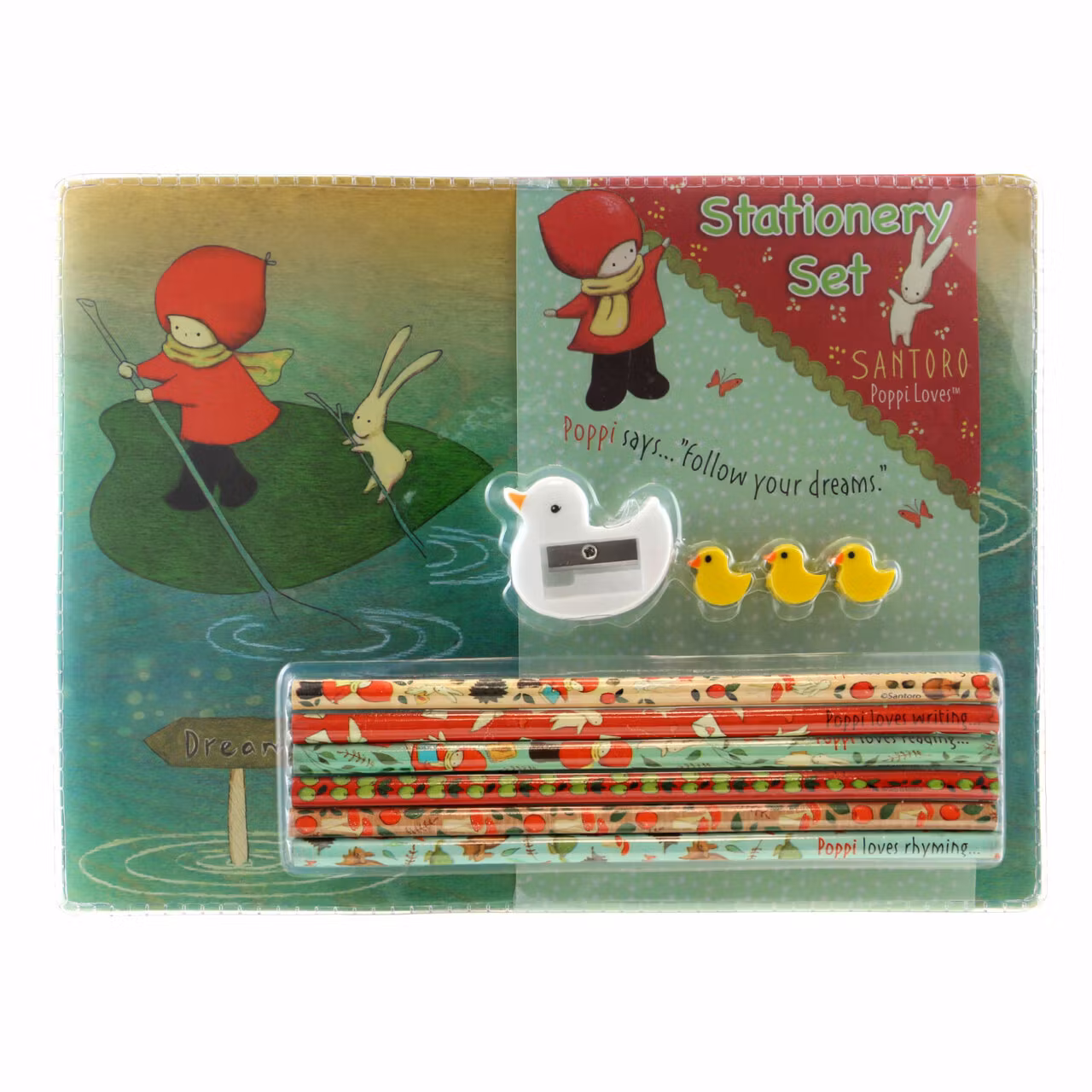 Set med pennor, pennvässare, sudd och block