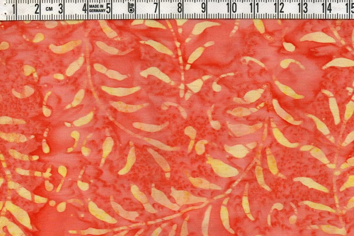 Orange med gult tryck. Samma mönster på tyg 3603-3608.  Batik bomull 110 cm