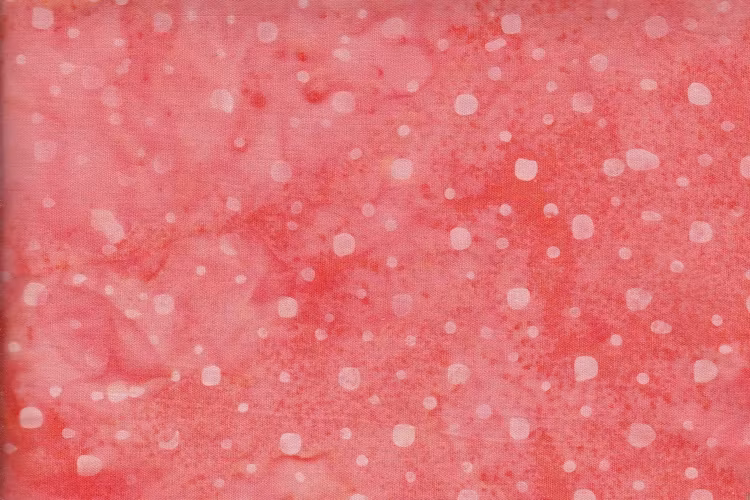 Ljus orange med prickar