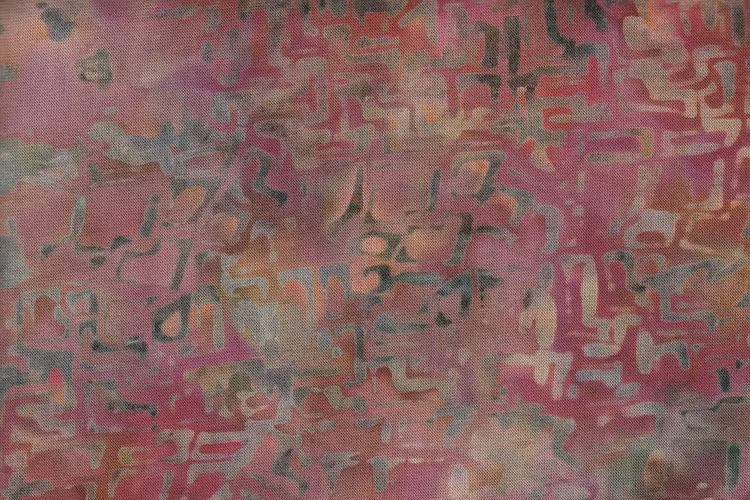 Labyrinttryck i rödbeigebruna nyanser. Trikå 100% bomull.  Bredd 140 cm