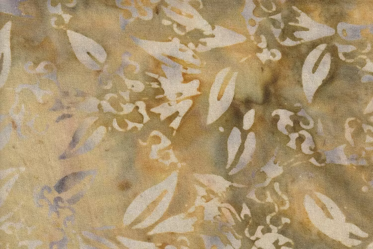 Beige och beigegrönt batiktyg i trikå 100% bomull. Bredd 140 cm