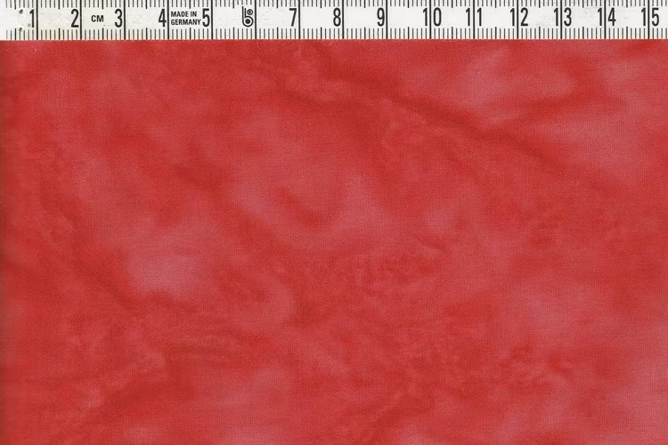 Läckert röd melerad. Ett batiktyg från Bali