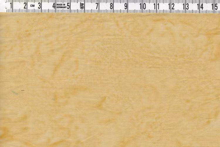 Senapsgul men med svag grön ton. Bomullstyg