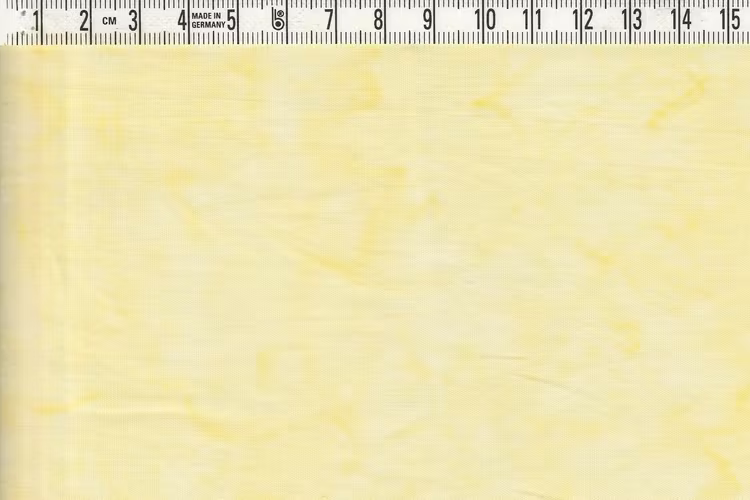 Ljuvligt ljusgulmelerat bomullstyg. Bredd 110 cm