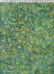 Snirkliga blommor i gult på grönmelerat. Balibatik
