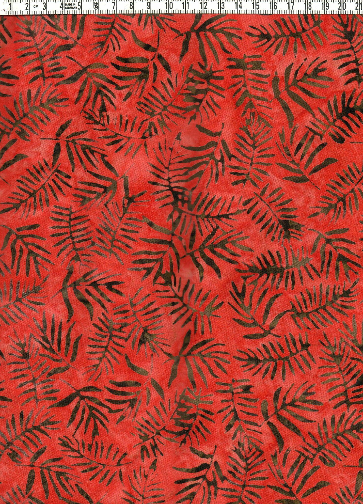 Fyllig, krämig rödorange & brunsvarta kvistar. Batik bomull 110 cm