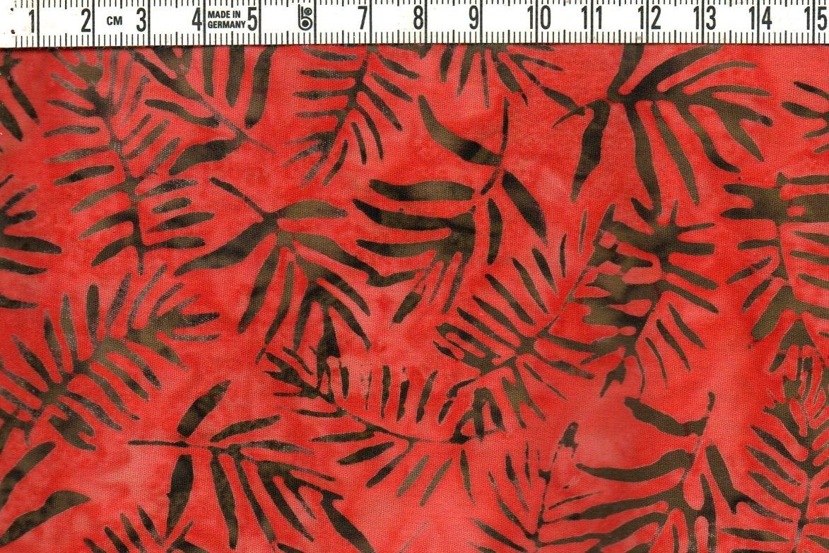 Fyllig, krämig rödorange & brunsvarta kvistar. Batik bomull 110 cm