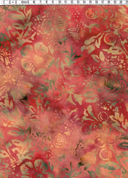 Orange-röd-brun-beige med tryck. Bredd 140 cm