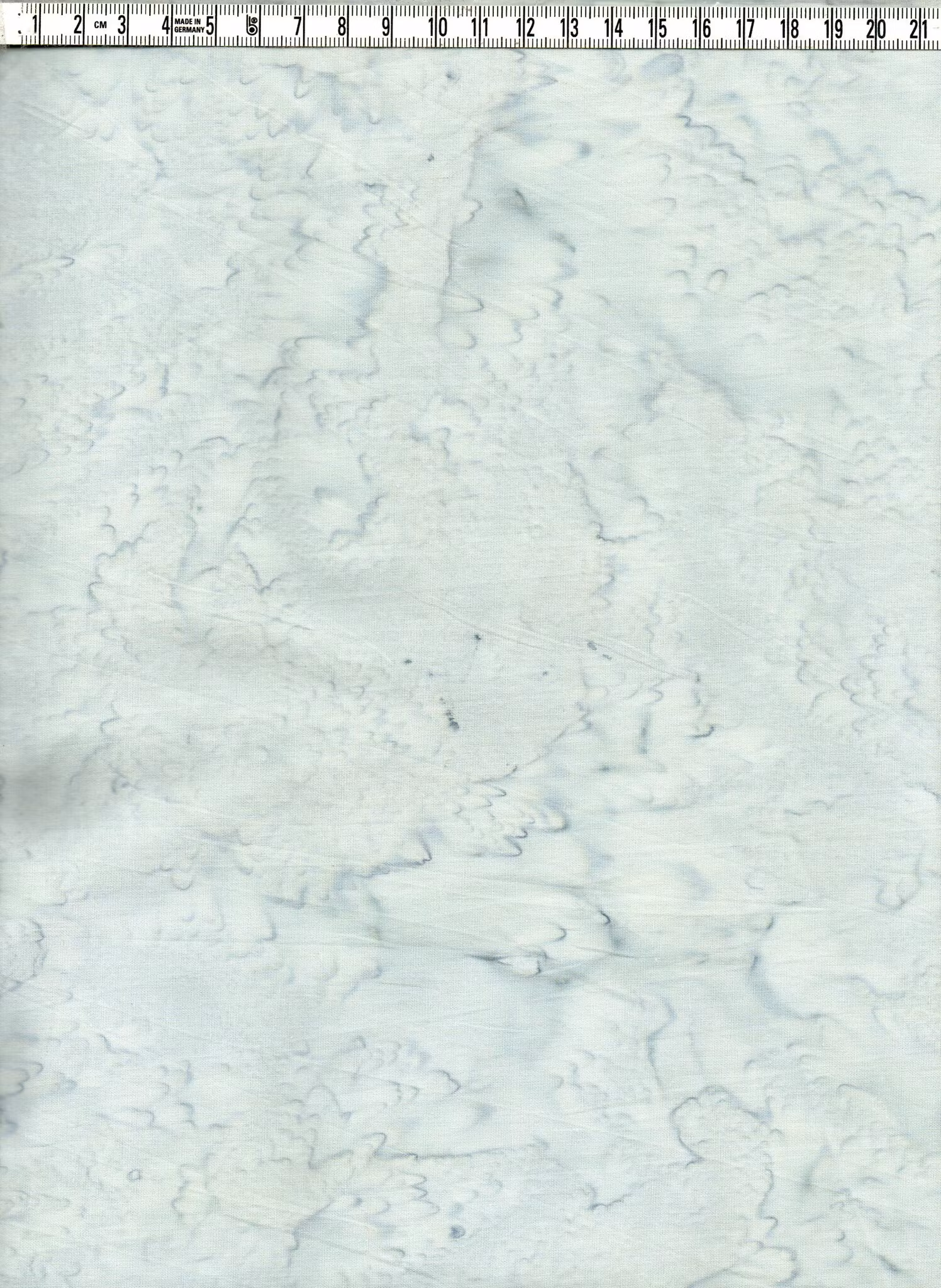 Melerad. Ljus blågrå med en aning grönaktig ton. Bomull. Bredd 110 cm