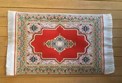 Vävd matta röd-rosa ton, ca 98 x 165 mm