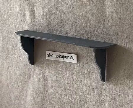 Hylla ca 89 mm lång, stålblå, "sliten"