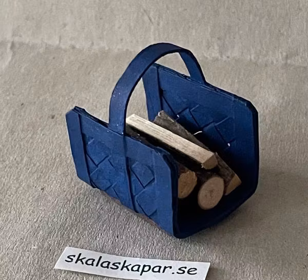 Vedkorg/vedhämtare med ved, blå