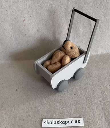 Dockbarnvagn med nalle, grå