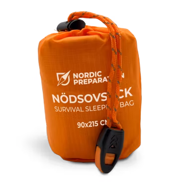 Nödsovsäck med nödvisselpipa