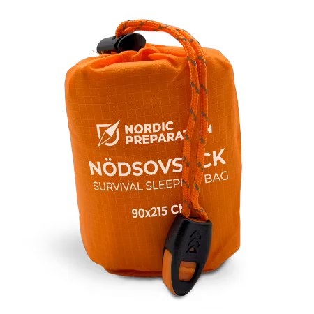 Nödsovsäck med nödvisselpipa
